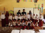 A group of children in a classroom AI-generated content may be incorrect.