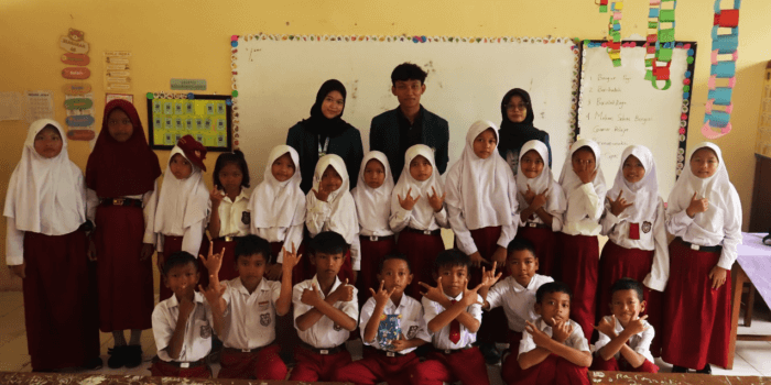 A group of children in a classroom AI-generated content may be incorrect.